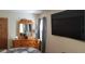 Bedroom featuring dresser with mirror and a large screen television at 107 Kelly St, Walterboro, SC 29488
