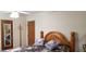 Bedroom with floral bedspread and wood headboard at 107 Kelly St, Walterboro, SC 29488