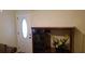 Inviting entryway features a front door with glass oval insert and attractive display shelving unit at 107 Kelly St, Walterboro, SC 29488