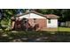 Well-maintained exterior showcasing a brick and siding facade, topped with a red roof at 107 Kelly St, Walterboro, SC 29488