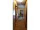 Hallway with wood paneling and hardwood floors at 107 Kelly St, Walterboro, SC 29488