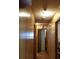 Hallway features wood paneling and multiple doors for convenient access to different areas of the home at 107 Kelly St, Walterboro, SC 29488