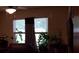 Living room window view with blinds and drapes bringing in natural light at 107 Kelly St, Walterboro, SC 29488