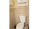 Bathroom toilet with white tank and neutral tile surround at 107 Kelly St, Walterboro, SC 29488