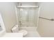 Bright bathroom featuring a glass-enclosed shower-tub combo at 107 Spalding Cir, Goose Creek, SC 29445
