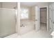 Bathroom showcasing a bathtub, separate shower, and natural light from a window at 107 Spalding Cir, Goose Creek, SC 29445