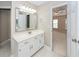 Bathroom with single sink vanity, large mirror and view to bedroom at 107 Spalding Cir, Goose Creek, SC 29445