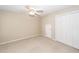 Neutral carpeted bedroom with a ceiling fan and ample closet space at 107 Spalding Cir, Goose Creek, SC 29445