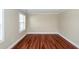 Bedroom with hardwood floors, base molding, and natural light from the window at 107 Spalding Cir, Goose Creek, SC 29445