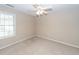 Inviting bedroom with a large window offering natural light and soft carpet at 107 Spalding Cir, Goose Creek, SC 29445
