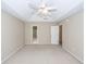 Bright bedroom featuring carpet, a ceiling fan, and doorways to the bathroom and hallway at 107 Spalding Cir, Goose Creek, SC 29445