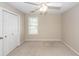 Bedroom featuring a closet with sliding doors, a window, and neutral carpet flooring at 107 Spalding Cir, Goose Creek, SC 29445