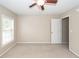 Comfortable bedroom featuring carpeted flooring, a ceiling fan, and a bright window at 107 Spalding Cir, Goose Creek, SC 29445