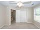 Bedroom featuring a closet with sliding doors, a ceiling fan, and natural light from a window at 107 Spalding Cir, Goose Creek, SC 29445