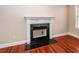 Close up of a marble surround fireplace with hardwood floors at 107 Spalding Cir, Goose Creek, SC 29445