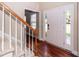Entryway featuring wood floors, a staircase, and a white front door with sidelights at 107 Spalding Cir, Goose Creek, SC 29445