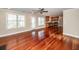 Open floor plan with hardwood floors, a kitchen and a door to the backyard at 107 Spalding Cir, Goose Creek, SC 29445