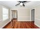 Inviting living room featuring hardwood floors, a ceiling fan, and classic molding at 107 Spalding Cir, Goose Creek, SC 29445