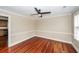 Living area featuring wood flooring, a ceiling fan, and view into the kitchen at 107 Spalding Cir, Goose Creek, SC 29445