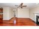 Open floor plan living room features hardwood floors, a fireplace, and nearby kitchen at 107 Spalding Cir, Goose Creek, SC 29445