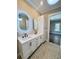 Beautiful bathroom featuring a double vanity with matte black faucets and decorative tile flooring at 107 Tracy St, Walterboro, SC 29488