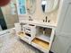 View of bathroom's vanity featuring double sinks, storage drawers and beautiful stone flooring at 107 Tracy St, Walterboro, SC 29488