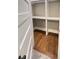 Walk-in closet with hardwood floor and built-in shelving providing ample storage space at 107 Tracy St, Walterboro, SC 29488