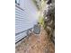 Exterior view of home featuring central AC unit and a wooden fence at 107 Tracy St, Walterboro, SC 29488