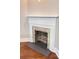 An old brick fireplace featuring a white mantle and a hearth at 107 Tracy St, Walterboro, SC 29488