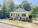 Charming white craftsman-style home with a welcoming front porch and manicured landscaping at 107 Tracy St, Walterboro, SC 29488