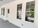 Inviting covered front porch featuring classic columns and painted wood floors at 107 Tracy St, Walterboro, SC 29488