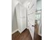 Bright hallway with storage, hardwood floors, and a door leading into the house, creating a welcoming entrance at 107 Tracy St, Walterboro, SC 29488
