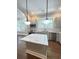 Kitchen view with an island, stainless appliances, a window over the sink, custom cabinets, and marble countertops at 107 Tracy St, Walterboro, SC 29488