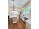 Bright kitchen features marble counters and island with access to open living space at 107 Tracy St, Walterboro, SC 29488