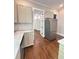 Bright kitchen with stainless steel appliances, stone countertops, and stylish cabinetry, creating a chef's dream space at 107 Tracy St, Walterboro, SC 29488