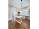The kitchen boasts marble counters and island with access to the sunlit living room at 107 Tracy St, Walterboro, SC 29488