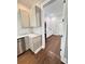 Spacious laundry room with custom cabinets, marble countertops, and wood floors at 107 Tracy St, Walterboro, SC 29488