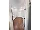 Clean, functional laundry room featuring modern appliances, a white sink and cabinets and hardwood floors at 107 Tracy St, Walterboro, SC 29488