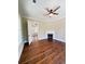 Beautiful living room with hardwood floors, white door, brick fireplace and natural light at 107 Tracy St, Walterboro, SC 29488