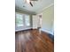 Inviting living room with hardwood floors, natural light, open door and view to outdoors at 107 Tracy St, Walterboro, SC 29488