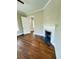 Living room with hardwood floors, beadboard ceiling, recessed lights, brick fireplace at 107 Tracy St, Walterboro, SC 29488