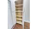 Spacious pantry featuring open shelves for organized storage, and a door for easy access in the kitchen at 107 Tracy St, Walterboro, SC 29488
