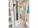 Bathroom featuring a glass shower with black trim and mosaic flooring at 107 Tracy St, Walterboro, SC 29488