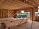 New construction showing the framing of a home with lumber stacked inside, along with nice views of the waterway at 11 Tabby Ln, Isle of Palms, SC 29451