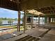 Under-construction home showcasing a waterfront view, wood framing, and spacious design at 11 Tabby Ln, Isle of Palms, SC 29451