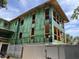 Multi-story house under construction, showcasing framed walls and Zip System sheathing at 11 Tabby Ln, Isle of Palms, SC 29451