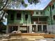 Unfinished multi-story home with Zip System sheathing and block construction at 11 Tabby Ln, Isle of Palms, SC 29451