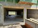 Unfinished garage with concrete floor and exposed cinder block walls at 11 Tabby Ln, Isle of Palms, SC 29451