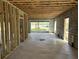 Unfinished interior with concrete floors, cinder block walls, and wooden frame construction at 11 Tabby Ln, Isle of Palms, SC 29451