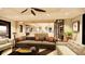Cozy living room with comfortable seating, a view to the kitchen, and elegant decor at 11 Tabby Ln, Isle of Palms, SC 29451